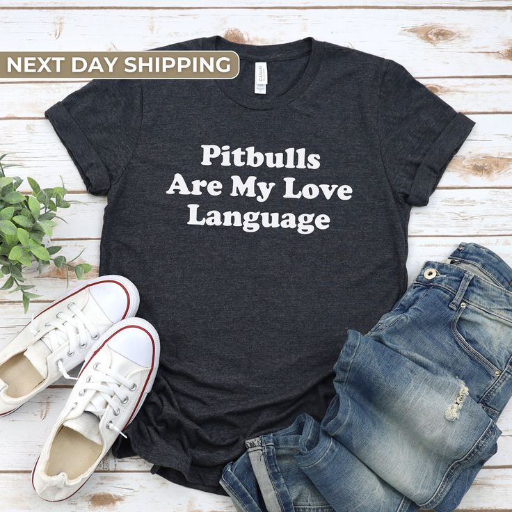 a t - shirt that says pit bulls are my love language next to some shoes