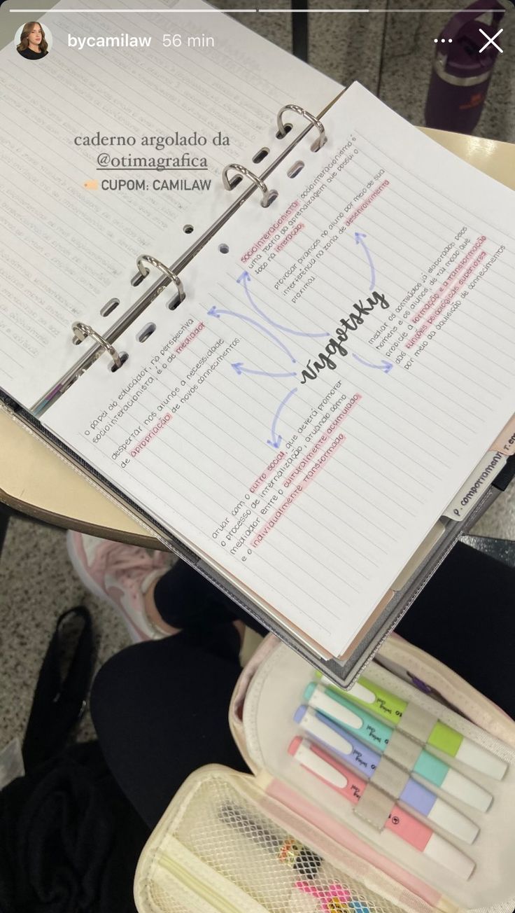 an open notebook sitting on top of a table