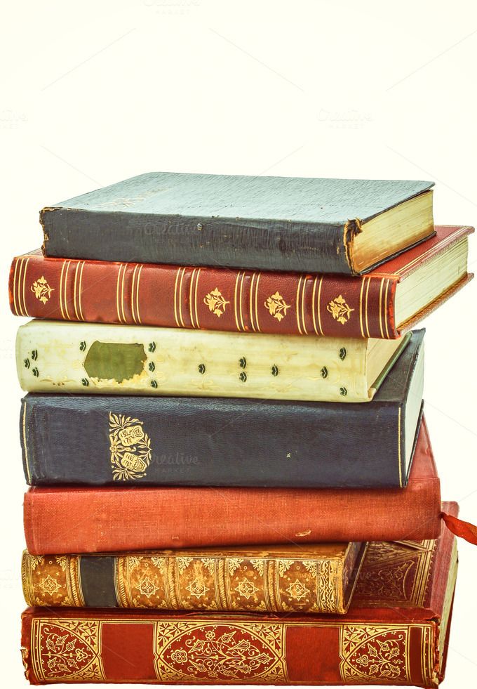 a stack of books sitting on top of each other in front of a white background