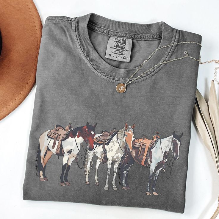 Saddle up in style with this Comfort Colors Horse Shirt, perfect for any horse lover! Whether you're a cowgirl at heart or a cowboy ready to ride, this equestrian t-shirt captures the spirit of the rodeo and the love of animals. It's the ultimate Horse Lover Gift, ideal for horse owners or anyone who adores the Western lifestyle. Made with soft, durable fabric, this shirt is designed for comfort and longevity, making it a go-to favorite in your wardrobe. Embrace the rodeo life with this stylish Western Shirts Women, Horseback Riding Outfit Casual, Country T Shirts, Cute Western Shirts, Western Gift Ideas, Western Tee Shirts, Barrel Racing Shirts, Cowgirl T Shirt, Western Style T-shirt For Rodeo