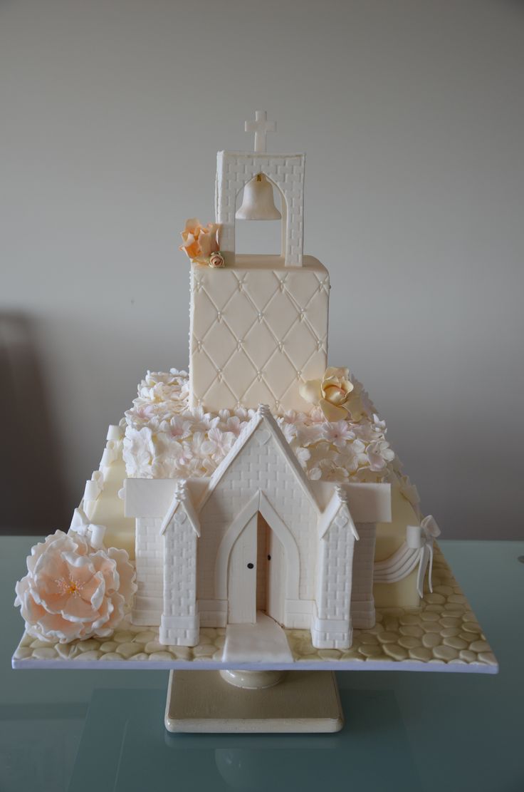 a wedding cake with a bride and groom on top