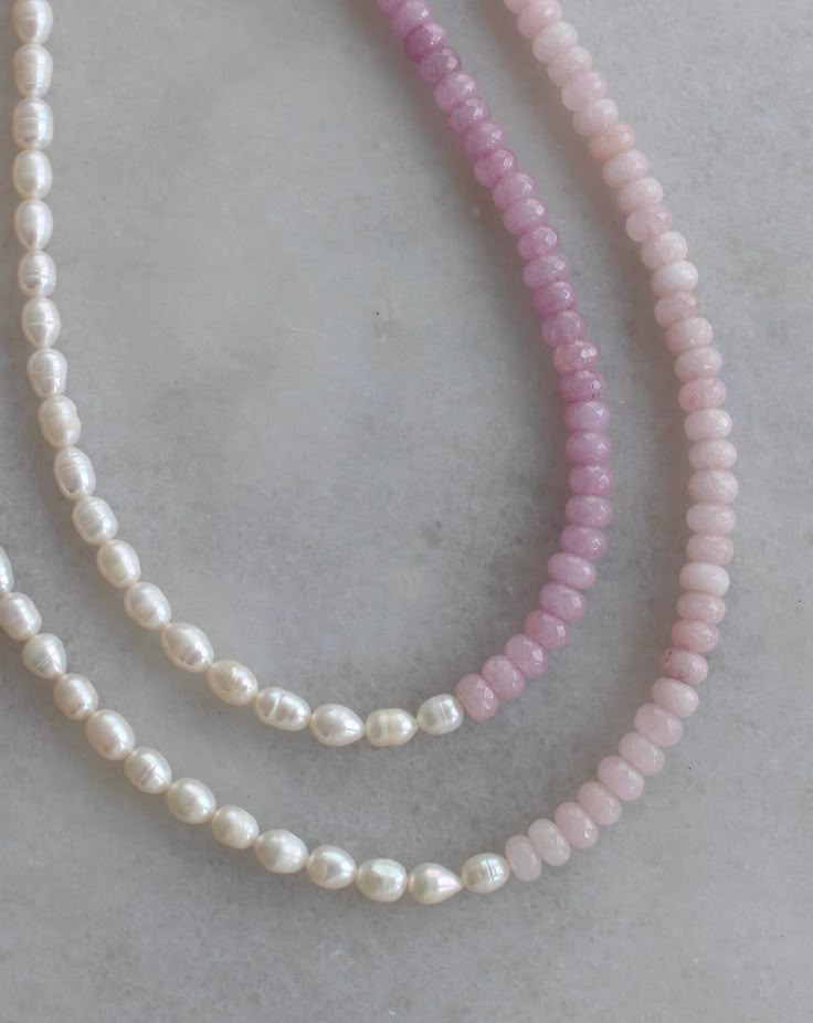 All things sweet & pearl! Choose from two gorgeous hues of pink and purple jade beads, split with real, freshwater pearls. Adjustable 15-17in. Finished off with 14K gold filled materials. Nickel and lead free. Pink Pearl Necklace With Natural Round Beads, Pink Pearl Necklace With Round Beads, Pink Pearl Necklace With Round Natural Stones, Pink Beaded Necklaces With Pearl Charm, Dainty Pink Pearl Necklace With Pearl Charm, Dainty Pink Pearl Necklace With Charm, Pink Pearl Beaded Necklaces With Gemstone Beads, Pink Dainty Pearl Chain Necklace, Pink Pearl Necklace With Gemstone Beads