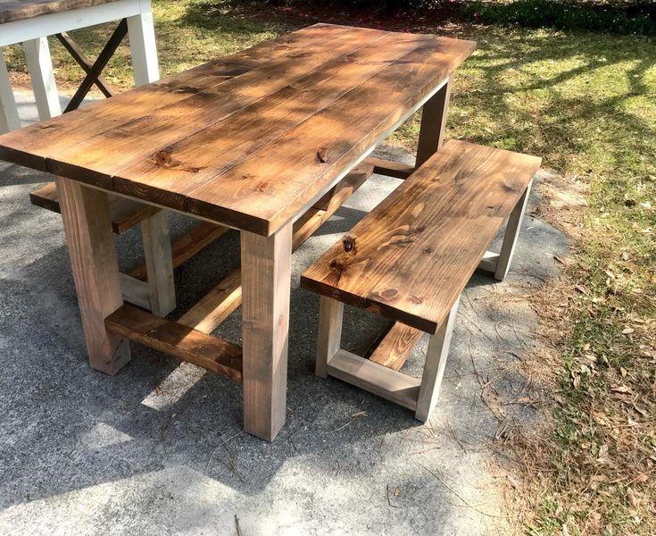 a picnic table and bench made out of wood