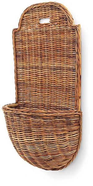 a wicker basket hanging on the wall