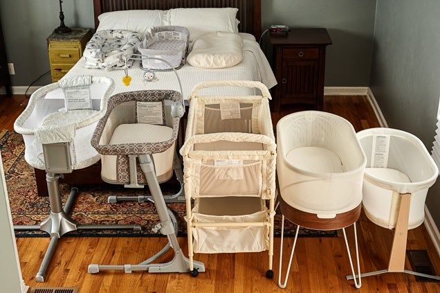 a baby's room with several cribs on the floor, including a bed