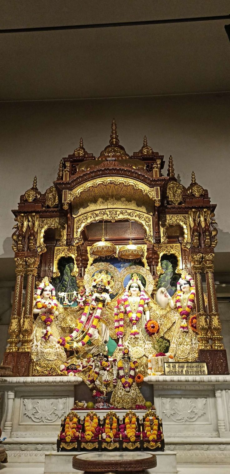 an elaborately decorated shrine with statues on it