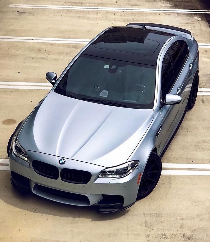 a silver car parked in a parking lot