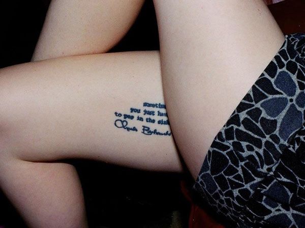 a woman with a tattoo on her lower leg that reads, i love you to the moon and back