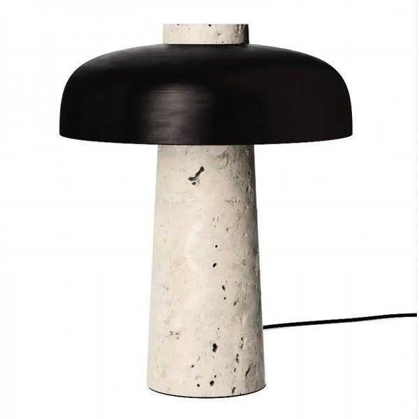 a black and white lamp sitting on top of a table