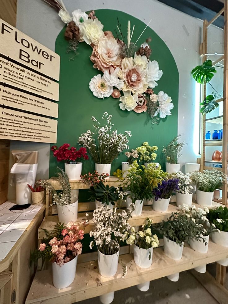 the flower shop has many different types of flowers on display