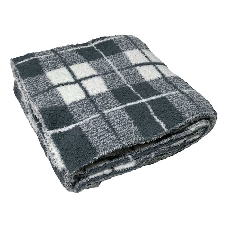 a black and white plaid blanket on a white background