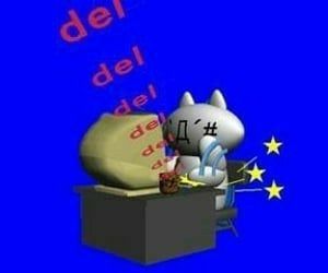 a cat sitting on top of a desk next to a sign that says del del