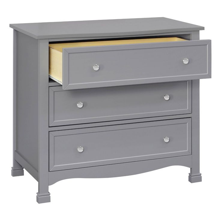 a gray dresser with two drawers and a yellow drawer on the bottom one is open