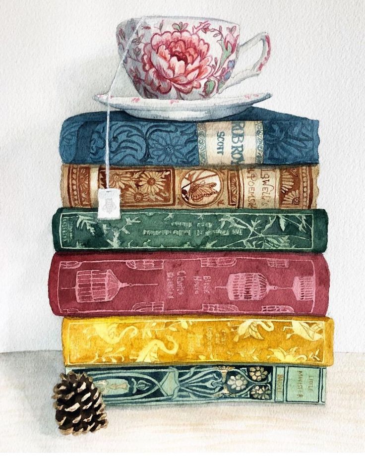 a stack of books with a tea cup on top of them and a pine cone