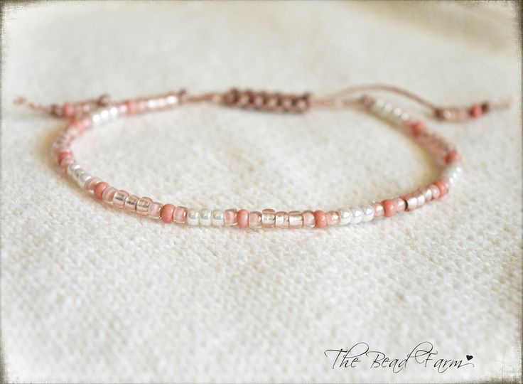 "Dainty Adjustable Yoga Style Anklet -or-  Bracelet with sliding closure. This dainty adjustable piece features tiny 8/0 seed beads in beautiful pale pastel peachy pinks and white.  All beads are strung on heavy weight nylon cord in blush color. The tail ends of the cord are securely knotted then \"fringed\" to give a little extra boho style. Stacks well with other jewelry pieces or can stand alone.  So dainty and cute.  So lightweight, you'll never know it's on! Style: ANKLET: opens fully to a Adjustable Pastel Bracelets With Round Beads, Pink Round Beads Anklets For Festival, Bohemian Pink Anklets With Round Beads, Adjustable Pink Anklet With Colorful Beads, Adjustable Peach Beaded Bracelets As Gift, Adjustable Beaded Coral Bracelet, Adjustable Peach Beaded Bracelet As Gift, Coral Beaded Adjustable Bracelets, Adjustable Pastel Beaded Bracelet