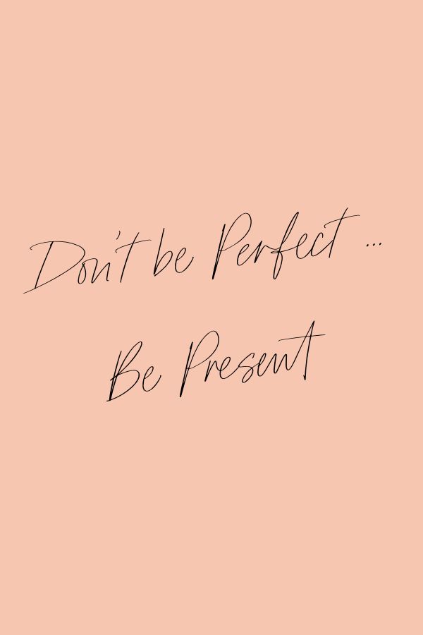 the words don't be perfect, be present are written on a pink background