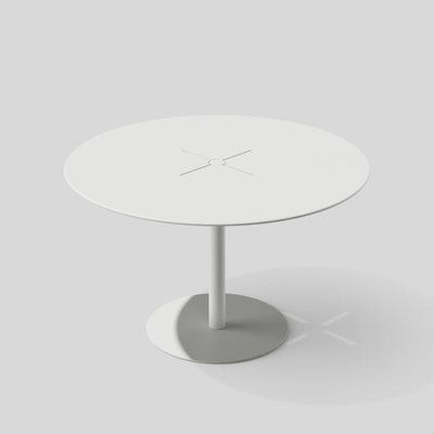 a white table sitting on top of a gray floor