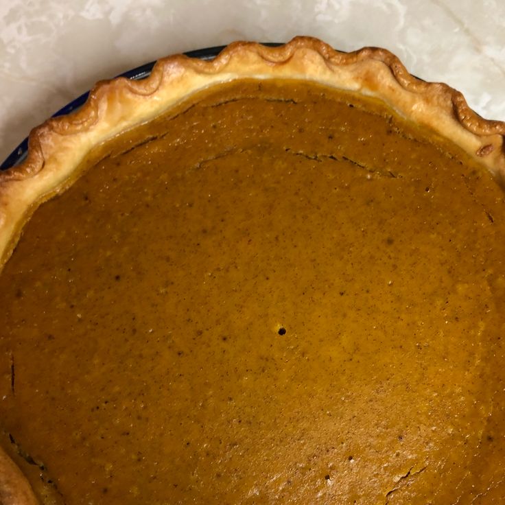 a pumpkin pie sitting on top of a table