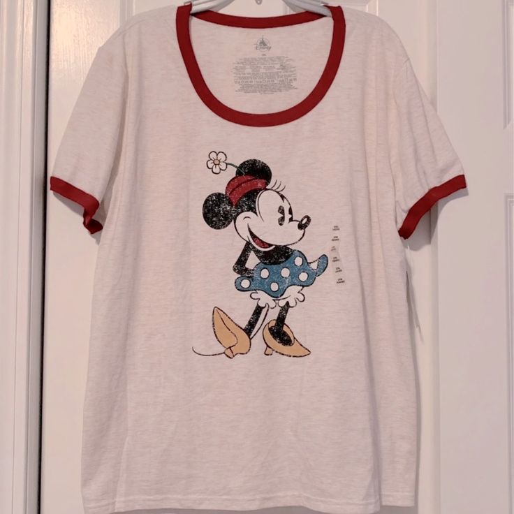 Brand New Disney Minnie A Mouse T-Shirt Heathered Jersey Knit Ribbed Contrast Scoop Neck And Sleeve Cuffs 50% Polyester 37% Cotton 13% Viscose Imported Color Is Off-White Disney Minnie Mouse Crew Neck T-shirt, Minnie Mouse Tops For Disney Fan Events, Minnie Mouse Graphic Tee With Crew Neck, Minnie Mouse Graphic Cotton Tee, Minnie Mouse Cotton Graphic Tee, Cotton Mickey Mouse Tops For Disney Trips, Cotton Minnie Mouse Graphic Tee, Disney Cotton Tops, Cute Minnie Mouse Tops For Disney Trips