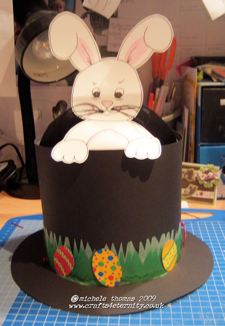 a paper hat with an image of a bunny in the top and ears sticking out