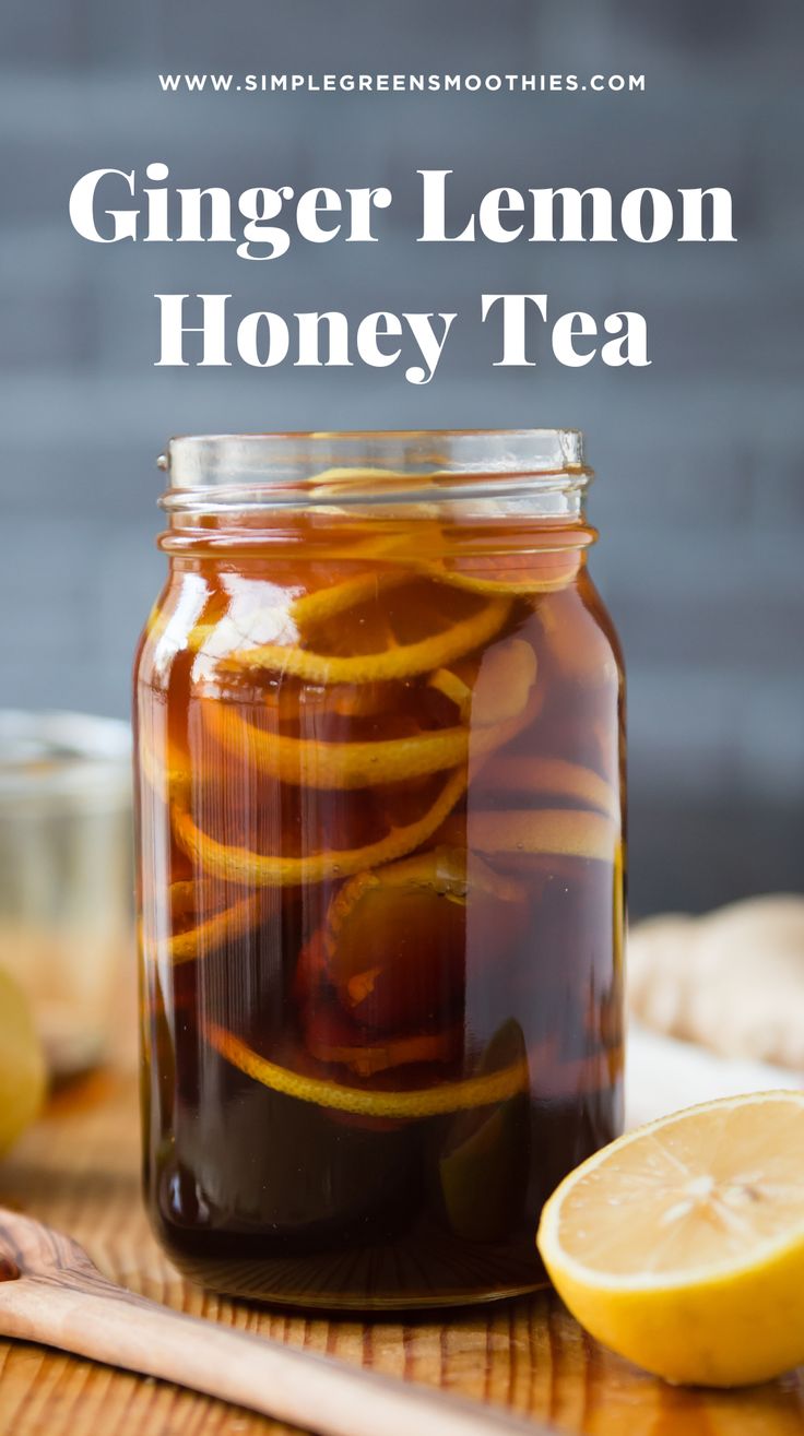 a glass jar filled with ginger lemon honey tea