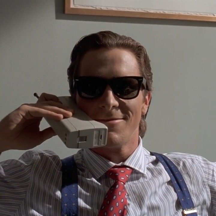 a man wearing sunglasses and suspenders talking on a phone with the caption,