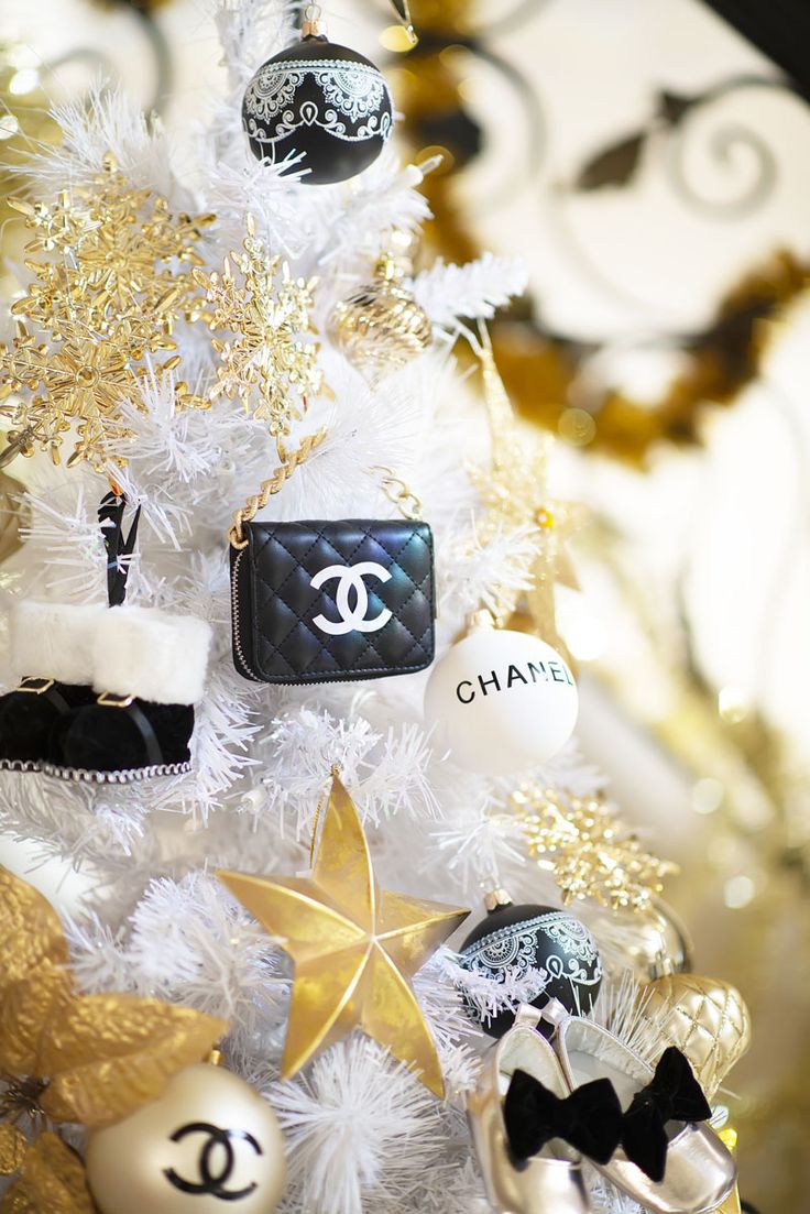 a chanel christmas tree with gold and white decorations