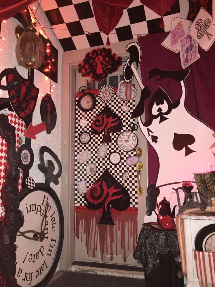 a door decorated with lots of different items and decorations on the outside wall, along with checkered walls