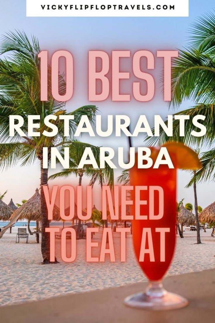 an orange drink sitting on top of a table next to palm trees and the words 10 best restaurants in arubaa you need to eat