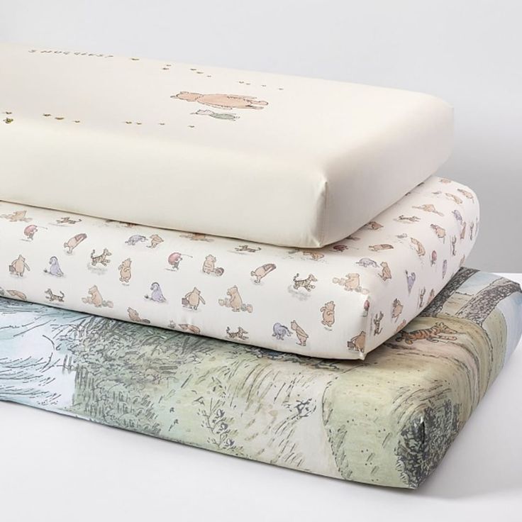 three sheets stacked on top of each other in different patterns and sizes, with animals printed on them