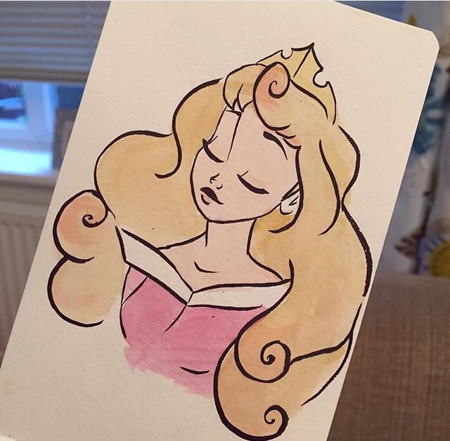 a drawing of a woman with blonde hair and a tiara on it's head