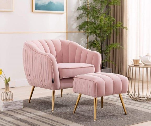 a pink chair and ottoman in a living room