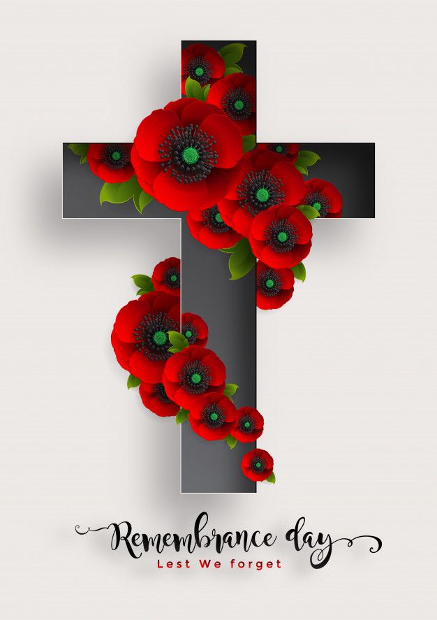 a cross with red flowers on it and the words remembrance day