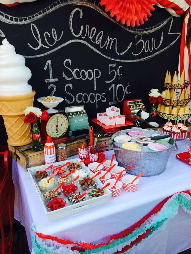 a table topped with lots of desserts and ice cream