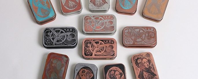 nine different types of metal magnets sitting on a table together, all with pictures of women and men in them