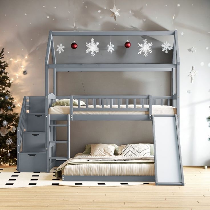 there is a bunk bed with stairs and snowflakes on the wall