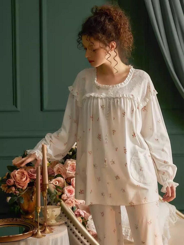 These Floral Print PJ Set has a French romance design style and a loose, comfortable, and elegant fit. The main material is cotton, which is made with Weaving technology to make the product more breathable and skin-friendly. Also, embroidered and elastic cuffs can make a person look more romantic and charming.  Type:  Pajamas  Color: White   Season: All Season  Style: Vintage/Romantic  Detail: Ruffled collar, Lace, Embroidered  Material: Cotton  Composition: 95% Cotton, 5% Polyester ＊Crafted fro Cotton Sleepwear With Floral Embroidery, White Cotton Sleepwear With Floral Embroidery, Spring Feminine Cotton Sleepwear, Feminine Cotton Sleepwear For Spring, Summer Cotton Sleepwear With Floral Embroidery, Spring Cotton Sleepwear With Floral Embroidery, Feminine Floral Cotton Sleepwear, Cotton Floral Print Sleep Top, Cotton Sleepwear With Floral Embroidery For Spring