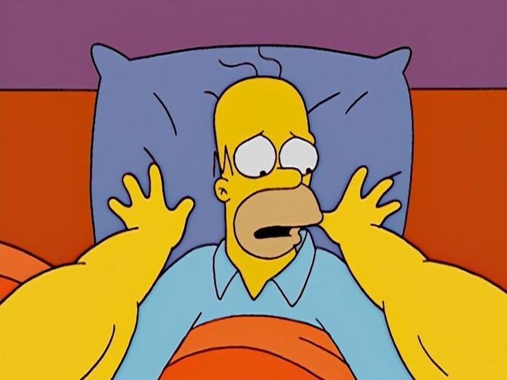 the simpsons is laying in bed with his hands up