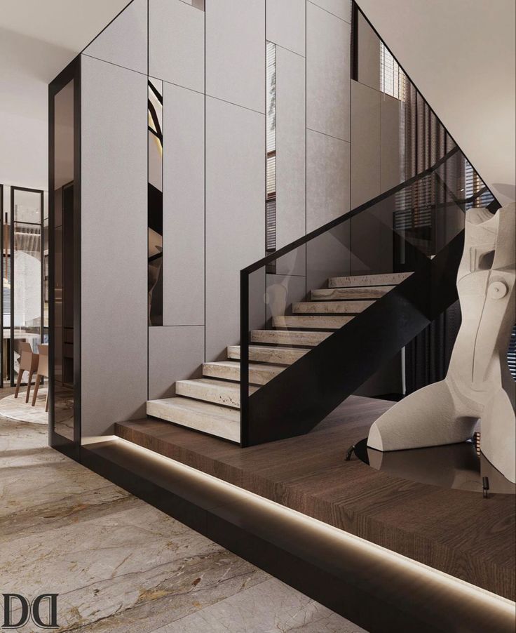 an elegant staircase in the middle of a room with marble flooring and white walls