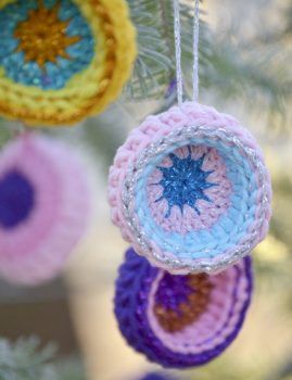 crocheted ornaments hanging from a christmas tree