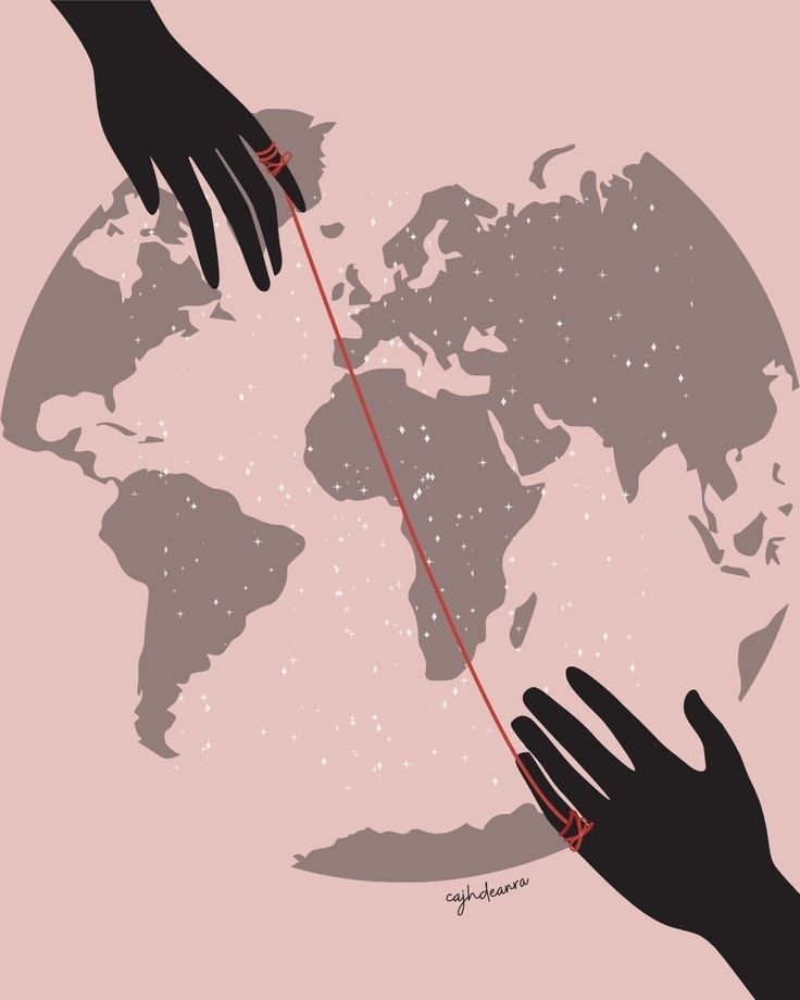 two hands reaching out to touch each other with a string on a world map in the background