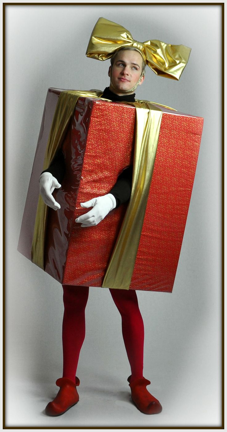 a man dressed up as a person with a box on his head and red shoes