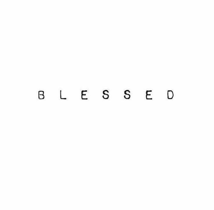 the word'blessed'is written in black ink on a white background