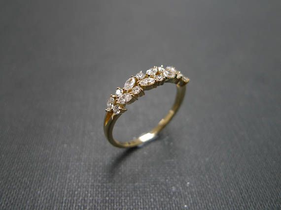 a diamond ring sitting on top of a table