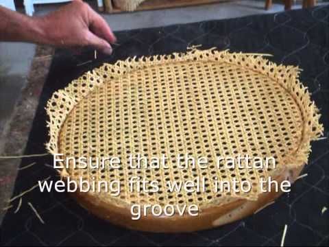 someone is cutting into a rattan covered cake