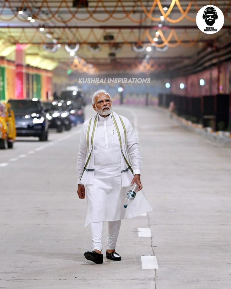 the man is walking down the street in his white outfit