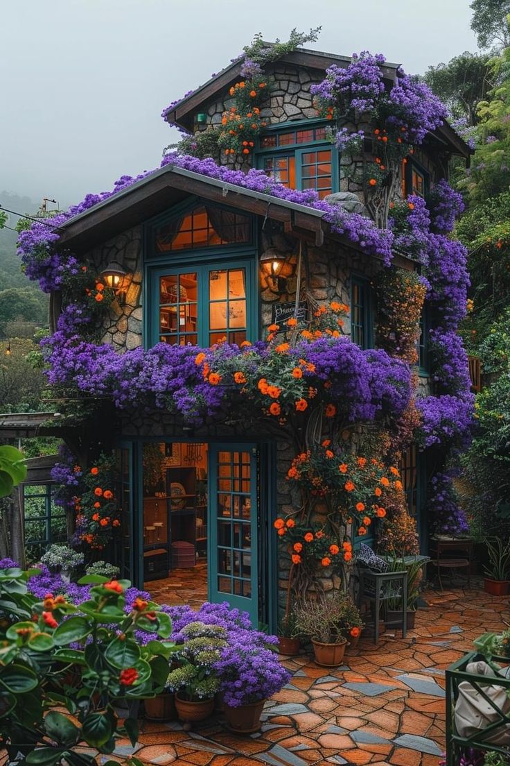 a house with flowers growing all over it