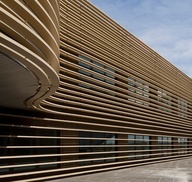 the side of a building that is made out of wooden slats