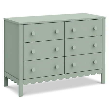 a green dresser with white dots on the top and bottom drawer, it has four drawers