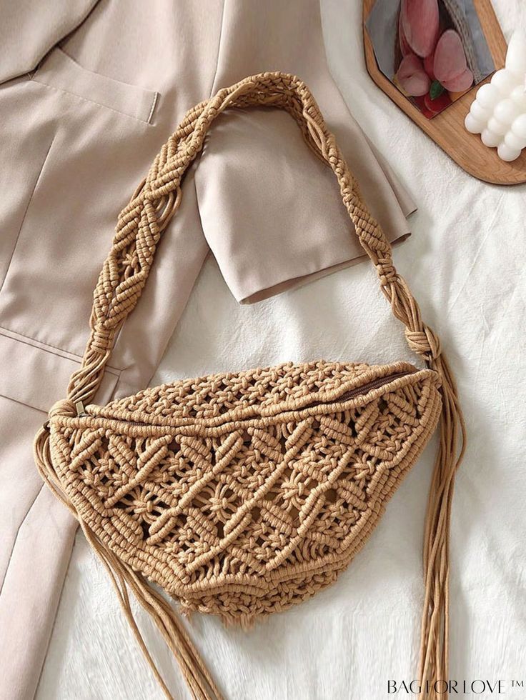 a woven purse sitting on top of a bed